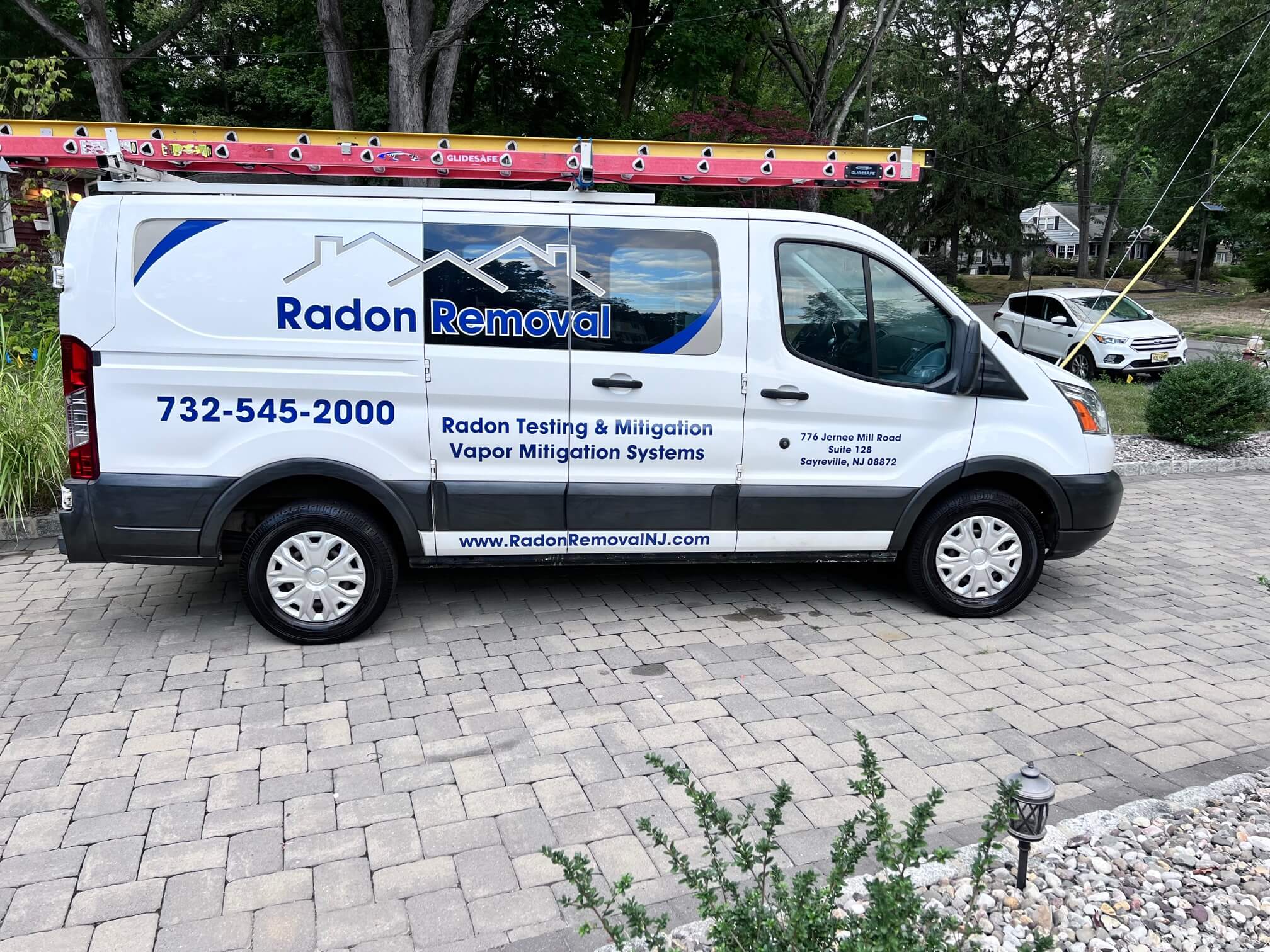 Certified technician installing radon mitigation system